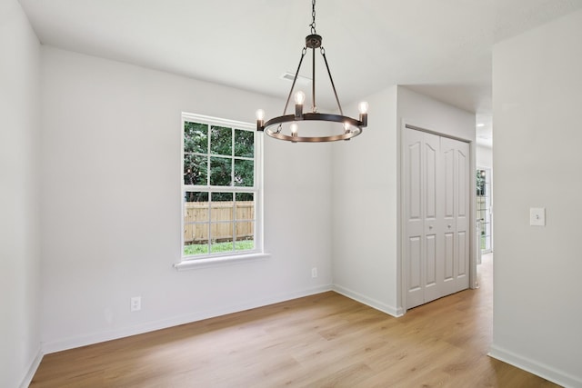 1033 Tom Hailey Blvd, La Vergne, TN 37086 - empty room featuring a chandelier and wood finished floors