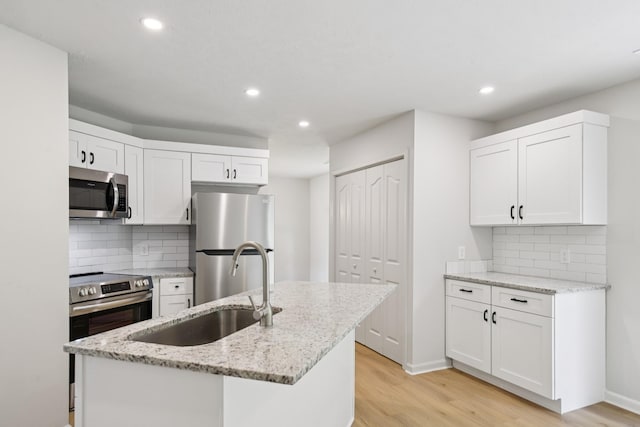 1033 Tom Hailey Blvd, La Vergne, TN 37086 - kitchen with appliances with stainless steel finishes, light wood-type flooring, recessed lighting, and white cabinets