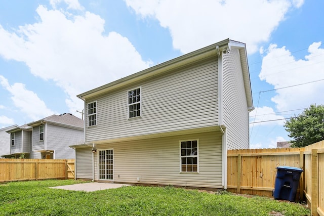1033 Tom Hailey Blvd, La Vergne, TN 37086 - back of property with a fenced backyard and a patio