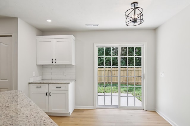 1033 Tom Hailey Blvd, La Vergne, TN 37086 - doorway with light wood-style flooring and recessed lighting