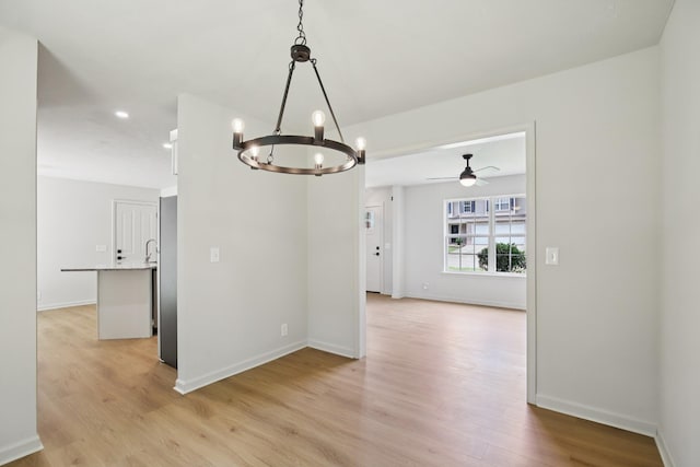 1033 Tom Hailey Blvd, La Vergne, TN 37086 - spare room featuring a chandelier, light wood-style flooring, ceiling fan, and recessed lighting