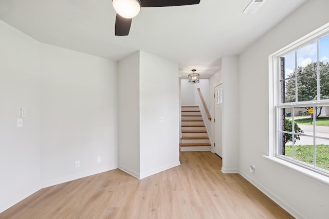 1033 Tom Hailey Blvd, La Vergne, TN 37086 - unfurnished room with light wood-type flooring, ceiling fan, and stairs