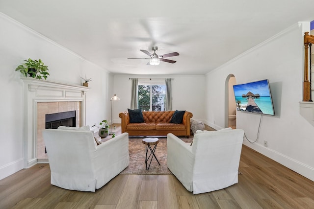 121 La View Rd, Hendersonville, TN 37075 - living room featuring ornamental molding, wood finished floors, a ceiling fan, and a tiled fireplace