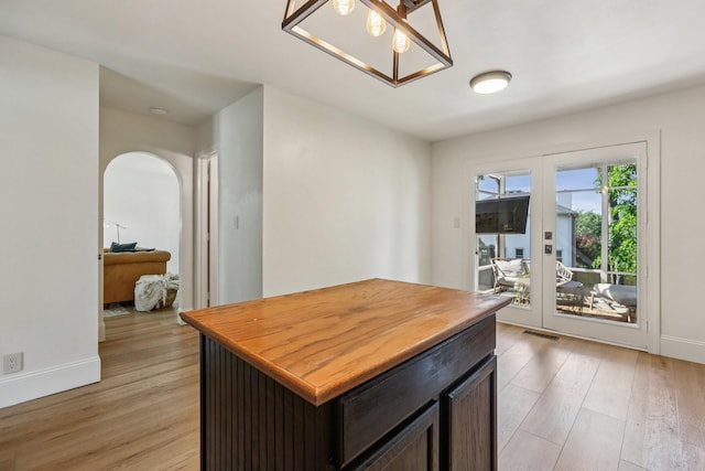 121 La View Rd, Hendersonville, TN 37075 - kitchen with light wood-type flooring, french doors, arched walkways, and wood counters