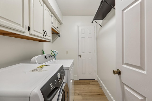 121 La View Rd, Hendersonville, TN 37075 - washroom featuring washer and dryer, cabinet space, and light wood-style flooring