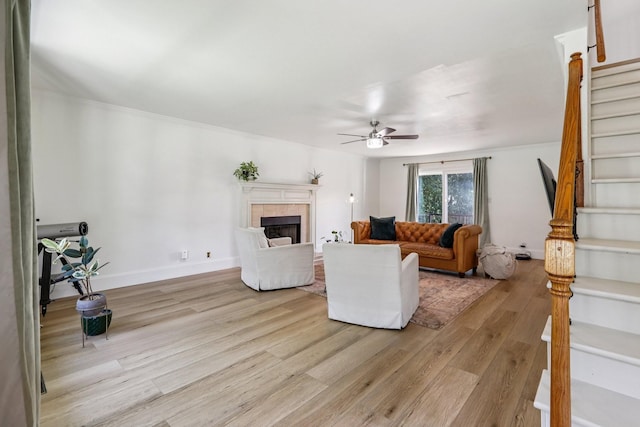 121 La View Rd, Hendersonville, TN 37075 - living room featuring stairway, light wood-style floors, a ceiling fan, and a fireplace