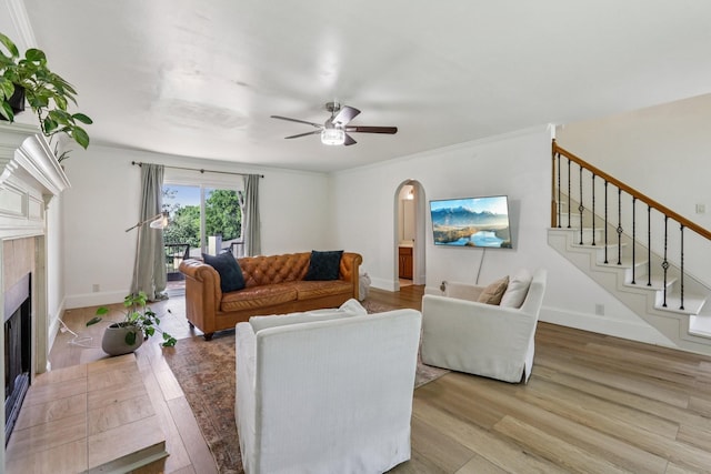 121 La View Rd, Hendersonville, TN 37075 - living area with light wood-style flooring, ceiling fan, a fireplace, arched walkways, and stairway
