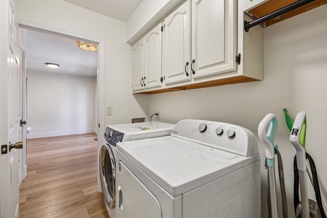 121 La View Rd, Hendersonville, TN 37075 - laundry room with washing machine and dryer, cabinet space, and light wood-type flooring