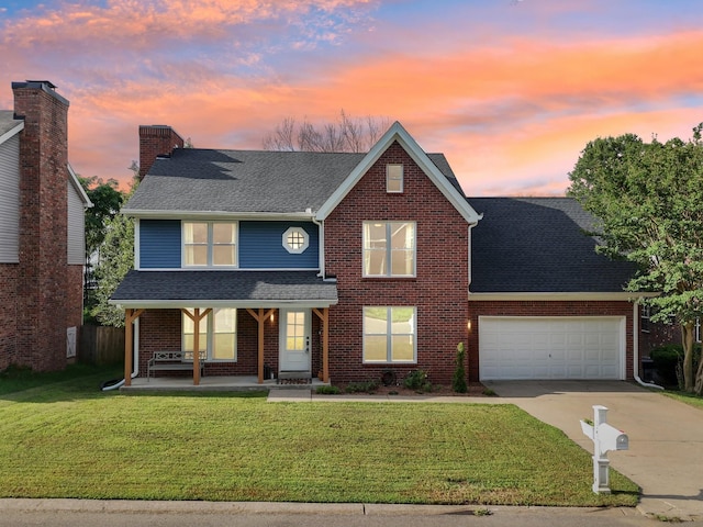 121 La View Rd, Hendersonville, TN 37075 - traditional-style house featuring covered porch, concrete driveway, an attached garage, a front yard, and a shingled roof