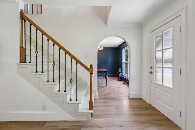 121 La View Rd, Hendersonville, TN 37075 - foyer featuring arched walkways, ornamental molding, stairs, and wood finished floors