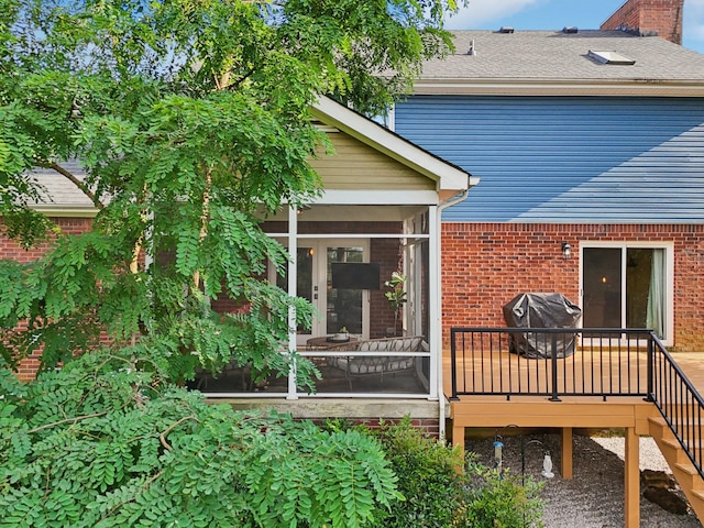 121 La View Rd, Hendersonville, TN 37075 - rear view of house with a sunroom, brick siding, a chimney, and stairway