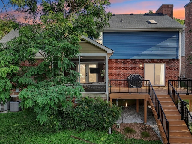 121 La View Rd, Hendersonville, TN 37075 - rear view of house featuring stairs, a wooden deck, brick siding, a sunroom, and a chimney