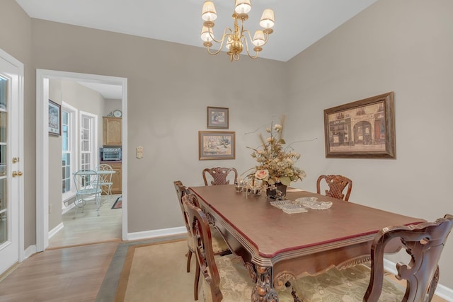 237 Woodmaker Ct, Nashville, TN 37214 - dining space with a chandelier and light wood-style floors