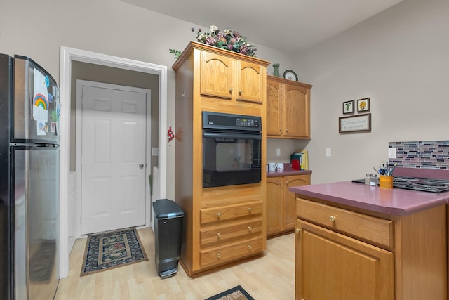237 Woodmaker Ct, Nashville, TN 37214 - kitchen featuring freestanding refrigerator, oven, light wood-style floors, and cooktop