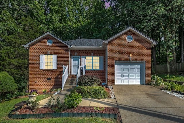 237 Woodmaker Ct, Nashville, TN 37214 - view of front of property featuring concrete driveway, brick siding, and an attached garage