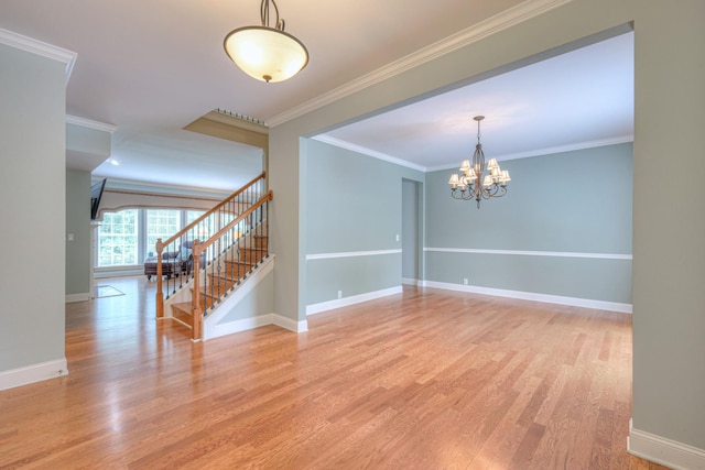 1222 Broadmoor Cir, Franklin, TN 37067 - empty room with stairway, wood finished floors, a chandelier, and ornamental molding