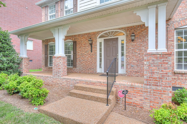 1222 Broadmoor Cir, Franklin, TN 37067 - doorway to property featuring a porch and brick siding