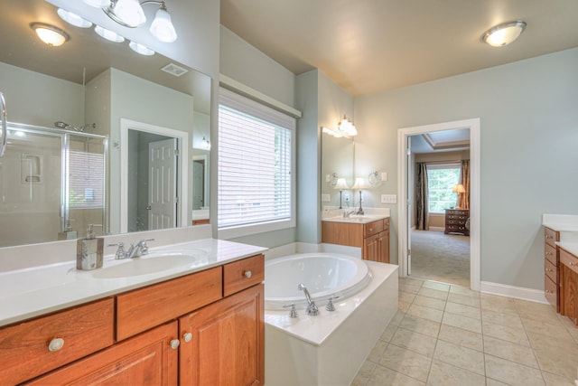 1222 Broadmoor Cir, Franklin, TN 37067 - full bathroom featuring two vanities, a stall shower, a bath, and tile patterned floors