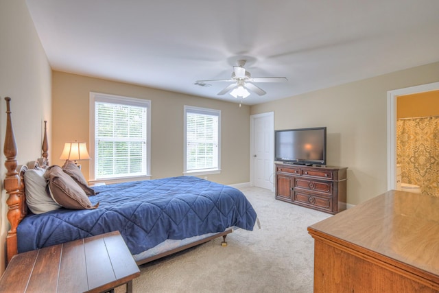 1222 Broadmoor Cir, Franklin, TN 37067 - bedroom with light colored carpet, ensuite bathroom, and a ceiling fan