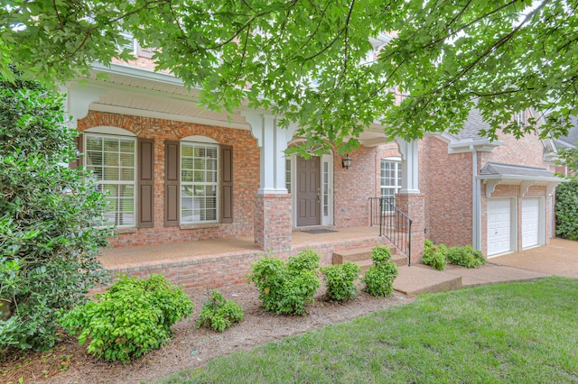 1222 Broadmoor Cir, Franklin, TN 37067 - view of front of property featuring concrete driveway, brick siding, a porch, and a front yard