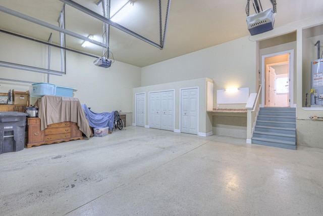 1222 Broadmoor Cir, Franklin, TN 37067 - garage featuring water heater and a garage door opener