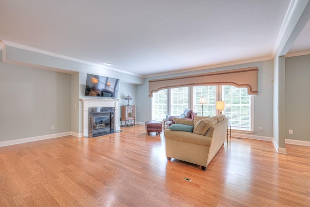 1222 Broadmoor Cir, Franklin, TN 37067 - living room with crown molding, light wood-style flooring, and a high end fireplace