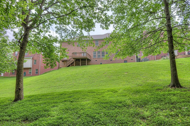 1222 Broadmoor Cir, Franklin, TN 37067 - view of green lawn with stairs and a wooden deck
