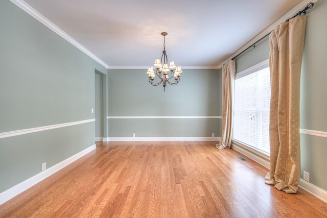 1222 Broadmoor Cir, Franklin, TN 37067 - unfurnished room with a chandelier, light wood-style flooring, and crown molding