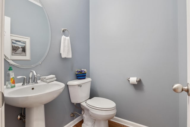 1057 Nealcrest Cir, Spring Hill, TN 37174 - half bathroom with toilet and wood finished floors