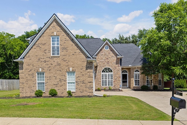 1057 Nealcrest Cir, Spring Hill, TN 37174 - traditional home featuring brick siding and a shingled roof