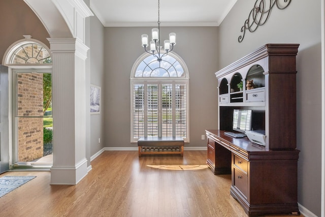 1057 Nealcrest Cir, Spring Hill, TN 37174 - office area featuring light wood finished floors, decorative columns, a chandelier, arched walkways, and ornamental molding