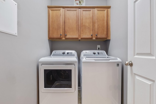 1057 Nealcrest Cir, Spring Hill, TN 37174 - laundry room with washing machine and dryer and cabinet space