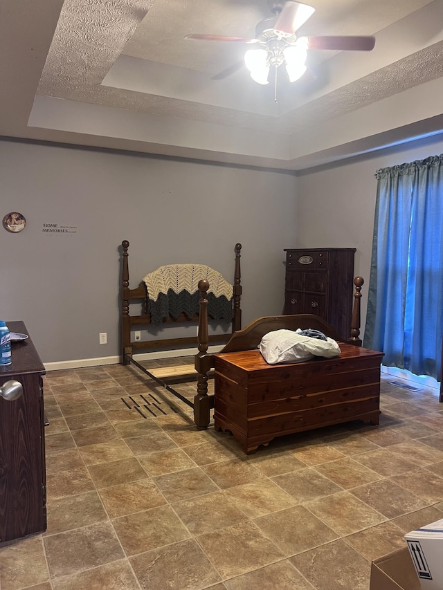 119 Boardwalk Way, Shelbyville, TN 37160 - bedroom featuring a tray ceiling, stone finish flooring, and a ceiling fan