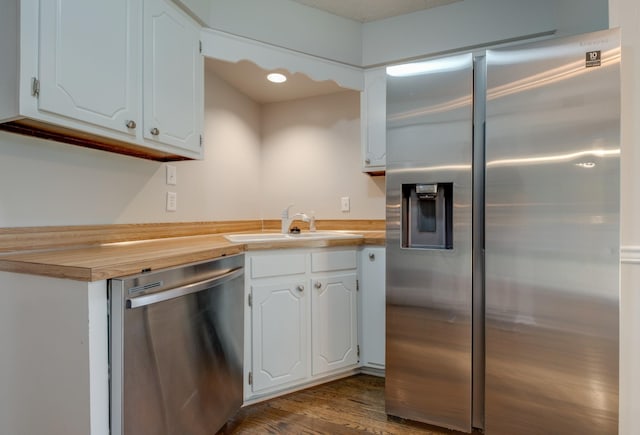 1524 Stone Hill Rd, Mount Juliet, TN 37122 - kitchen with stainless steel appliances, wood counters, white cabinetry, and dark wood finished floors
