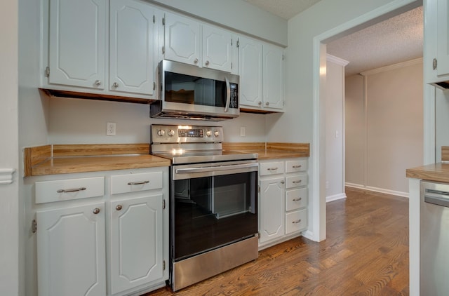 1524 Stone Hill Rd, Mount Juliet, TN 37122 - kitchen featuring appliances with stainless steel finishes, dark wood-type flooring, white cabinets, light countertops, and a textured ceiling