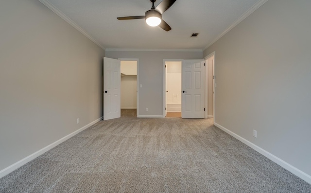 1524 Stone Hill Rd, Mount Juliet, TN 37122 - unfurnished bedroom with crown molding, carpet floors, a walk in closet, and a ceiling fan
