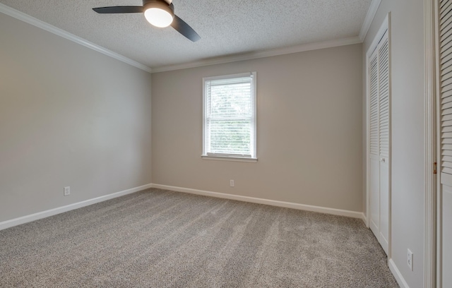 1524 Stone Hill Rd, Mount Juliet, TN 37122 - unfurnished bedroom featuring a textured ceiling, carpet flooring, crown molding, a closet, and a ceiling fan