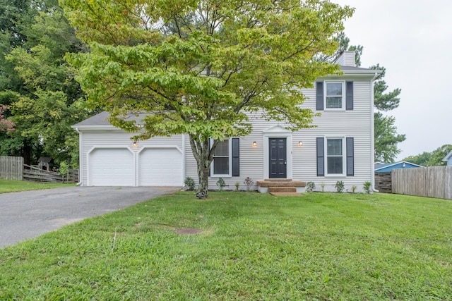 1524 Stone Hill Rd, Mount Juliet, TN 37122 - view of front facade featuring asphalt driveway, an attached garage, and a chimney