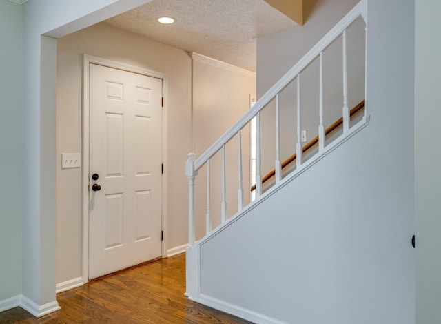 1524 Stone Hill Rd, Mount Juliet, TN 37122 - foyer featuring wood finished floors, recessed lighting, stairs, and a textured ceiling