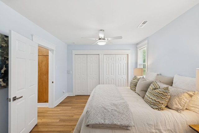1237 Abiff Rd, Bon Aqua, TN 37025 - bedroom with wood finished floors, two closets, and a ceiling fan