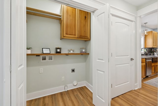 1237 Abiff Rd, Bon Aqua, TN 37025 - laundry area with electric dryer hookup, light wood-style flooring, cabinet space, washer hookup, and hookup for a gas dryer