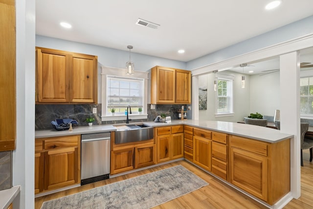 1237 Abiff Rd, Bon Aqua, TN 37025 - kitchen featuring stainless steel dishwasher, light wood-style floors, plenty of natural light, decorative backsplash, and recessed lighting