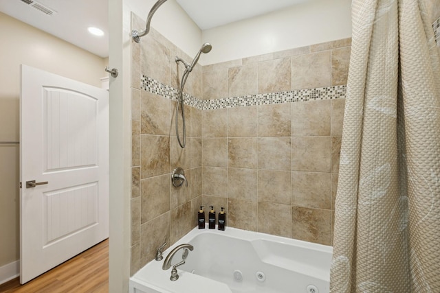 1237 Abiff Rd, Bon Aqua, TN 37025 - bathroom with a combined bath / shower with jetted tub and wood finished floors