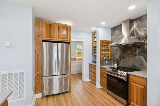 1237 Abiff Rd, Bon Aqua, TN 37025 - kitchen featuring appliances with stainless steel finishes, wall chimney exhaust hood, backsplash, light wood-type flooring, and open shelves