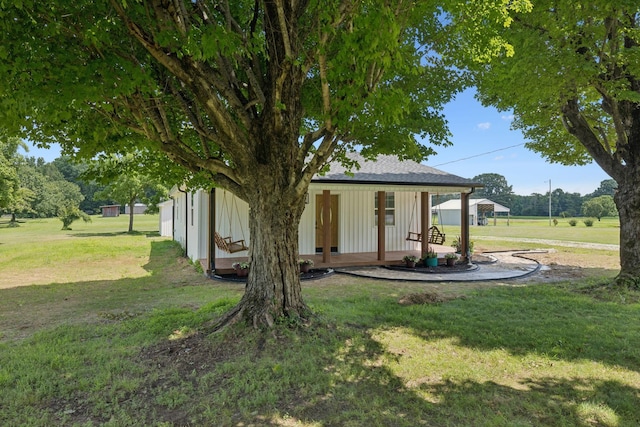 1237 Abiff Rd, Bon Aqua, TN 37025 - view of front facade featuring a front yard and board and batten siding