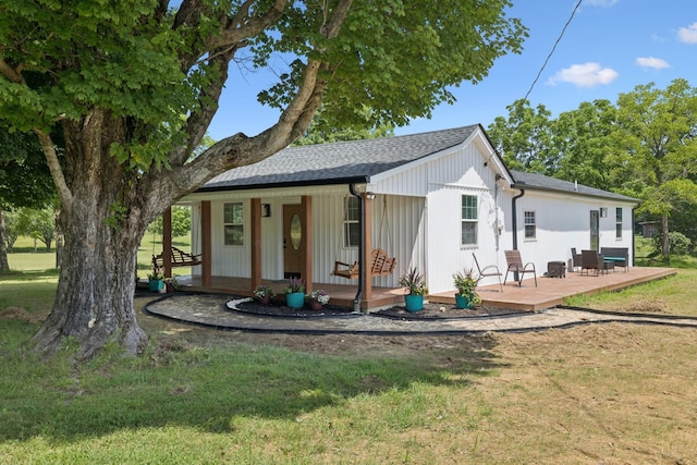 1237 Abiff Rd, Bon Aqua, TN 37025 - view of front facade featuring a front lawn, a shingled roof, and a porch