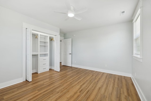 1237 Abiff Rd, Bon Aqua, TN 37025 - unfurnished bedroom with light wood-style flooring, ceiling fan, and a closet