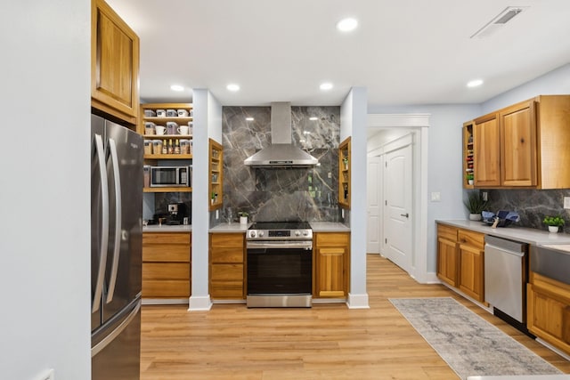 1237 Abiff Rd, Bon Aqua, TN 37025 - kitchen with wall chimney range hood, appliances with stainless steel finishes, decorative backsplash, light countertops, and recessed lighting