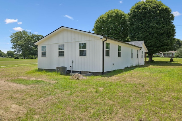 1237 Abiff Rd, Bon Aqua, TN 37025 - view of side of home featuring a lawn and a central AC unit