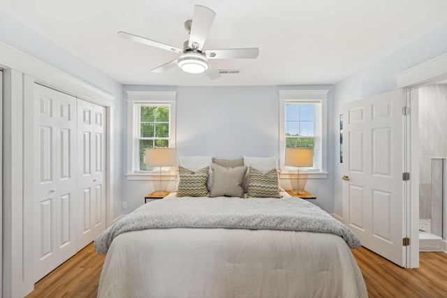 1237 Abiff Rd, Bon Aqua, TN 37025 - bedroom featuring light wood finished floors, a closet, and ceiling fan